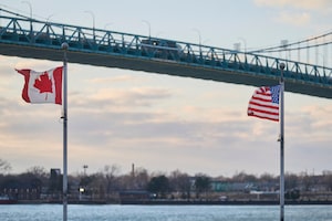A truck crosses the Ambassador Bridge, border crossing between Windsor, Ontario, Canada, and Detroit, Michigan, above the Canadian Vietnam Veterans Memorial on March 1, 2025. US President Donald Trump confirmed that 25 percent tariffs on products from Mexico and Canada would be effective from March 4. (Photo by Geoff Robins / AFP) (Photo by GEOFF ROBINS/AFP via Getty Images)